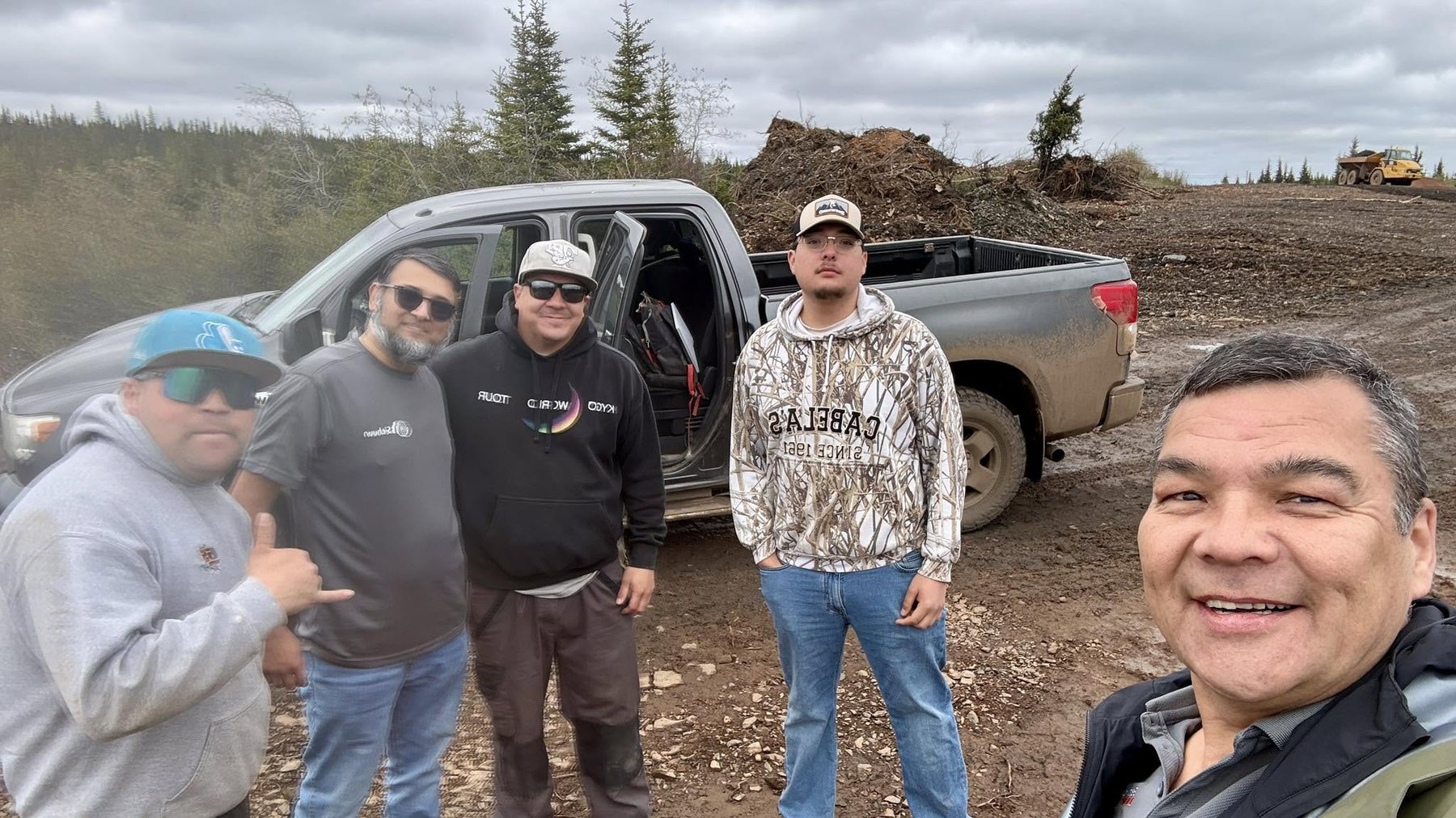 Preparation team on site with a truck and machinery.